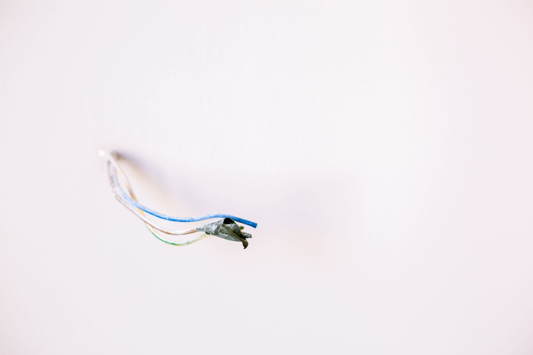 Damaged and exposed electrical wiring identified during a safety inspection by Call Paul Contracting, Edmonton