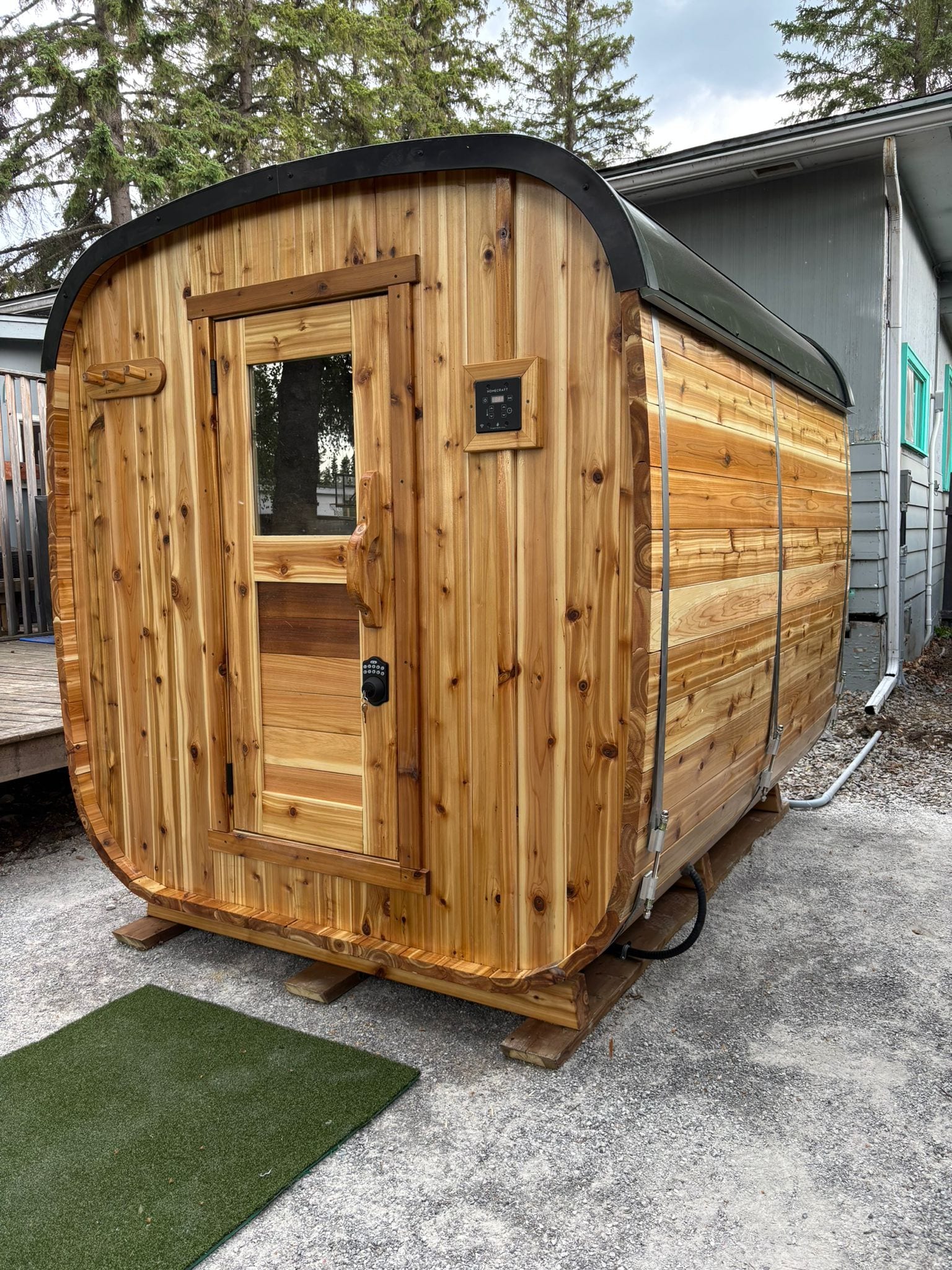 Outdoor cedar sauna wired and powered by Call Paul Contracting, Edmonton