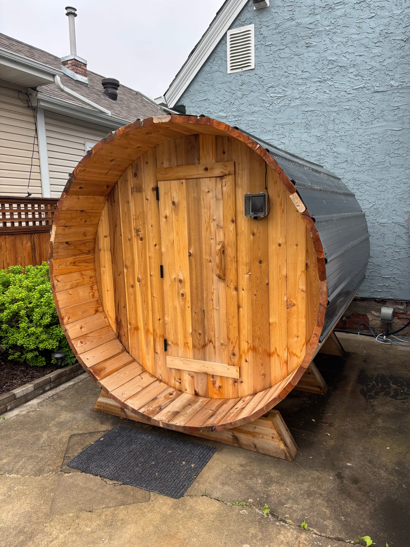Outdoor cedar barrel sauna wired and powered by Call Paul Contracting, Edmonton